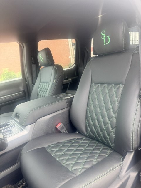 Embroidered initials on a headrest